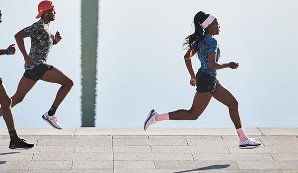 runners wearing the UA Flow Velociti Wind